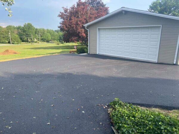 How many tons are in a Square Yard of Asphalt